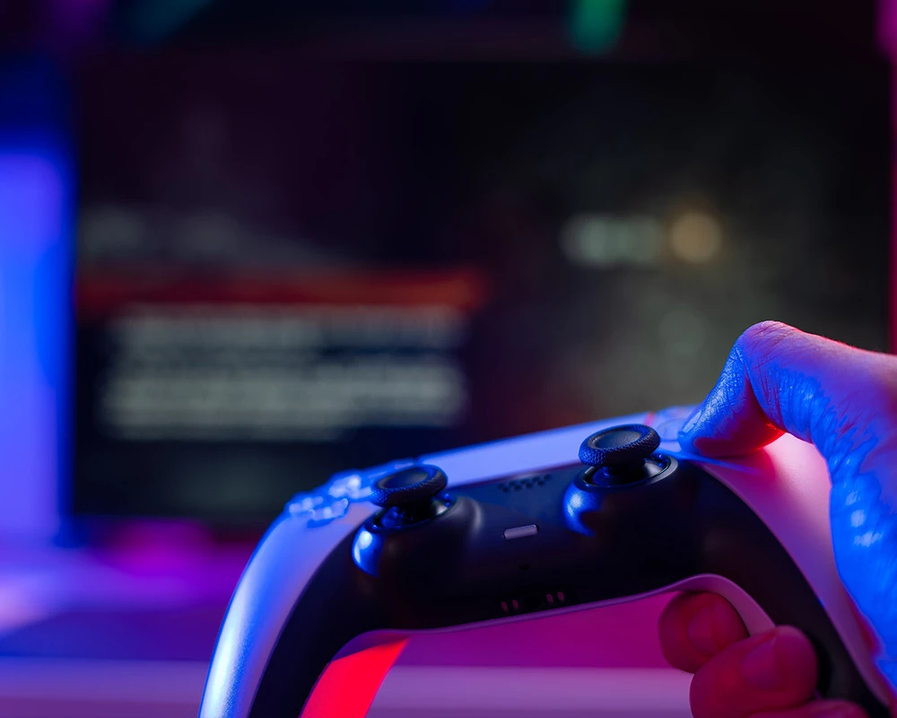 Gaming addiction with a controller videogame on the tv.