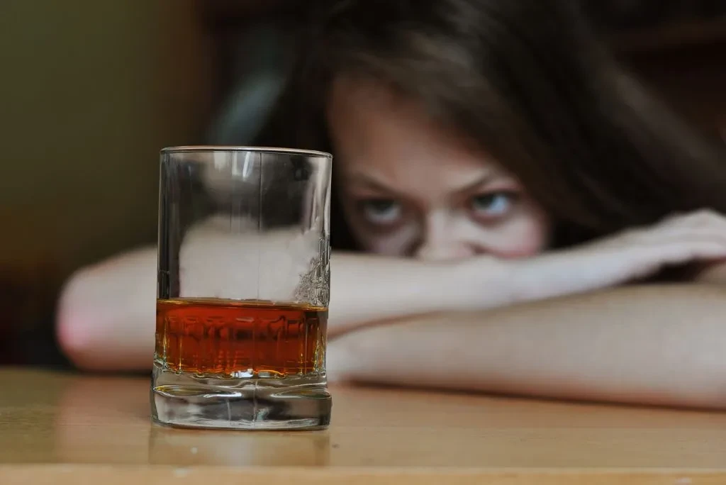 woman-staring-at-glass-alcohol woman-staring-at-glass-alcohol