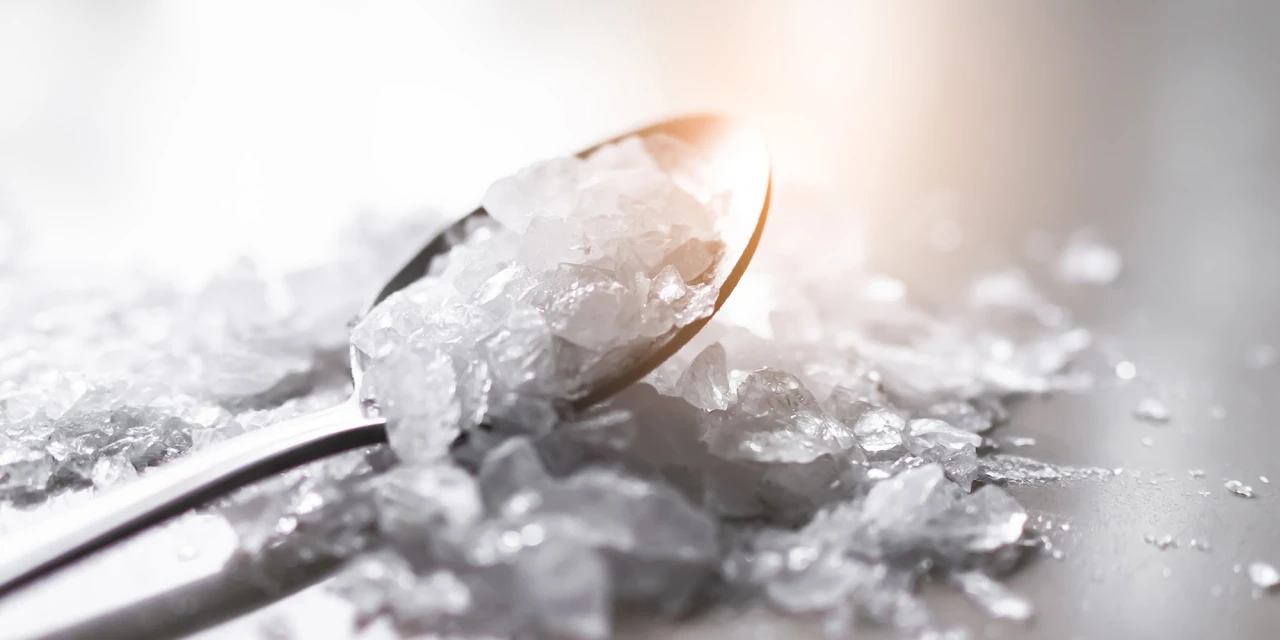A spoon filled with crystal-like stimulant drugs lies on a surface, illustrating substance misuse and the dangerous effects linked to speed addiction.