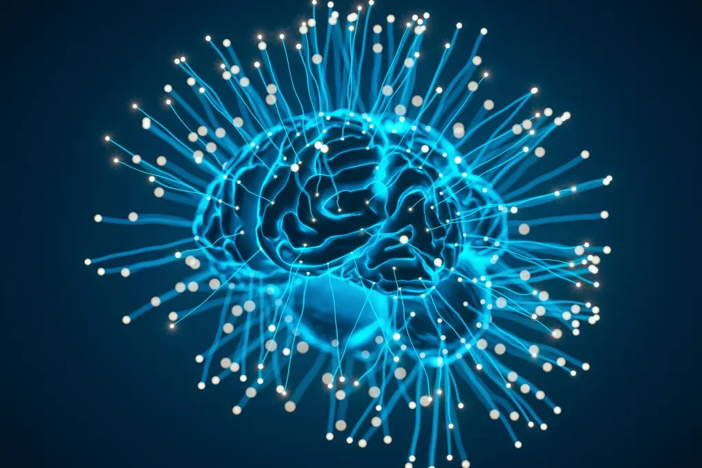 brain-bright-blue A brain highlighted in bright neon blue against a dark blue background.