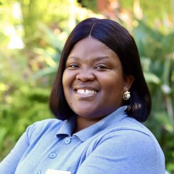Portrait of Portia Tyulu, social worker at rehab clinic in South Africa.