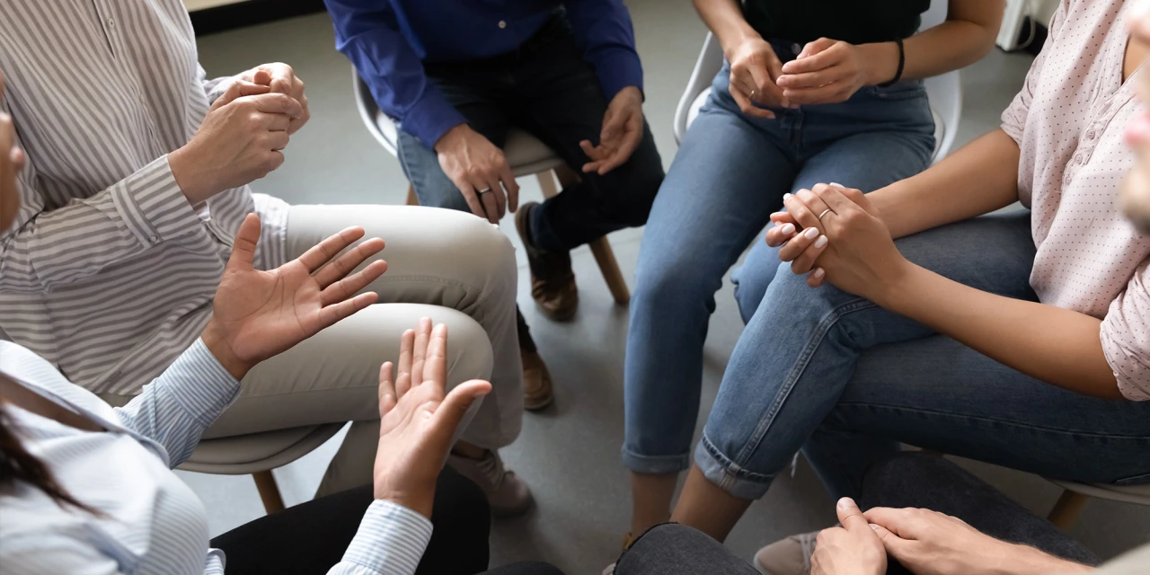 On the CMH about us page, clients take part in a guided group therapy discussion about mental health, addiction and recovery.