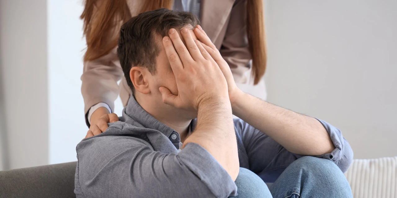 A therapist supports someone experiencing emotional distress, showing the importance of guidance, treatment and connection during addiction recovery.