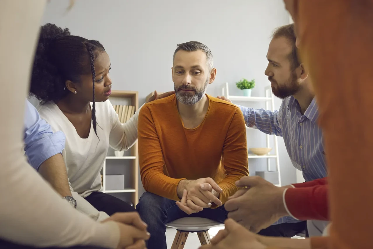 man-comforted-during-conversation